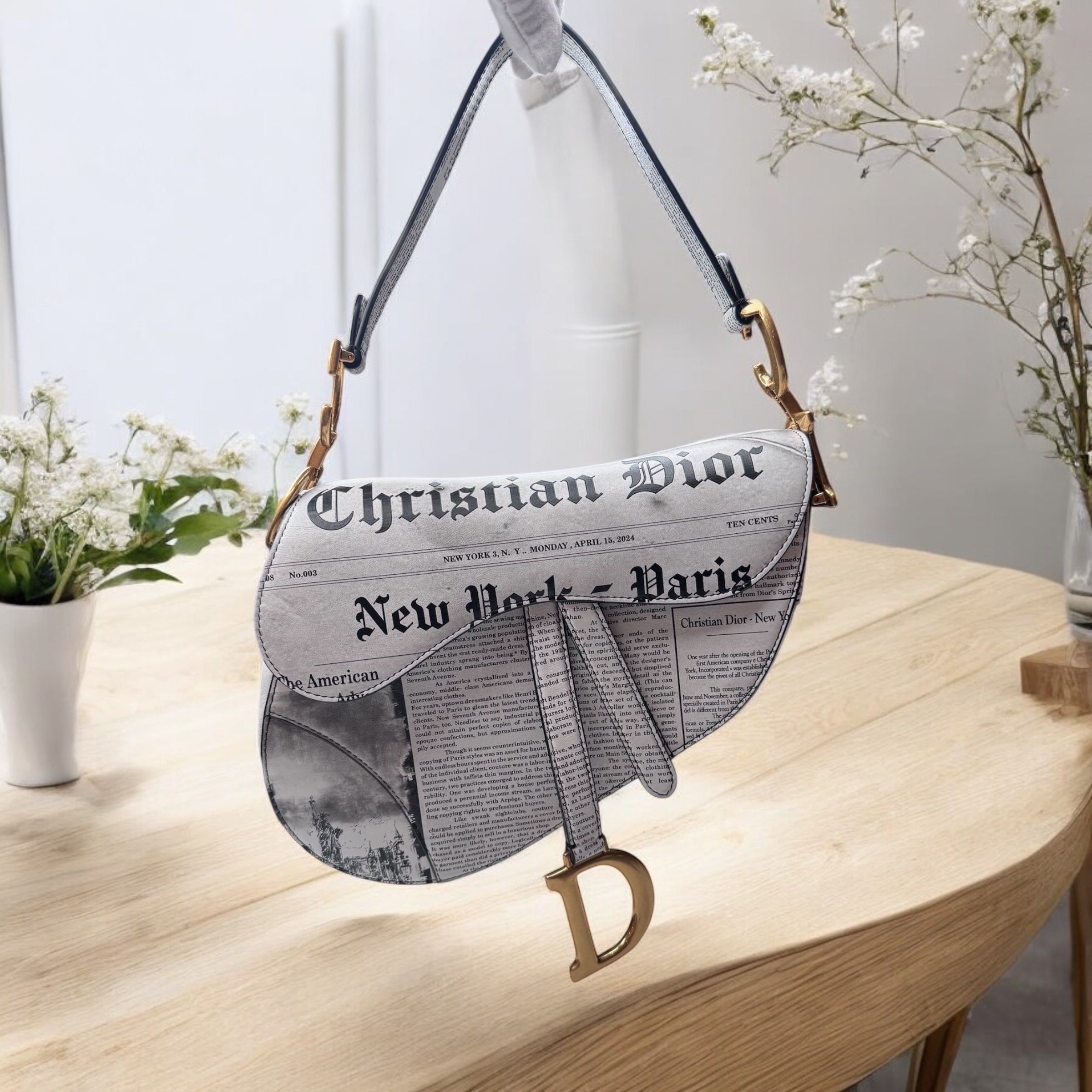 Dior Newspaper Saddle Bag | Bold & Artistic Design
